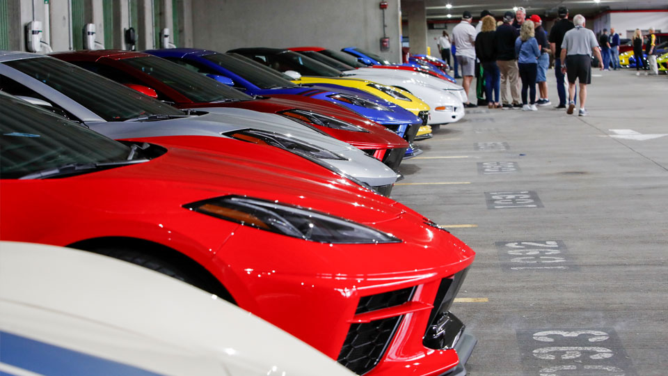 Corvettes lined up in a parking garage