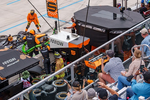 Fans in the Pit Lane Suite watch Pato O'Ward during a pit stop