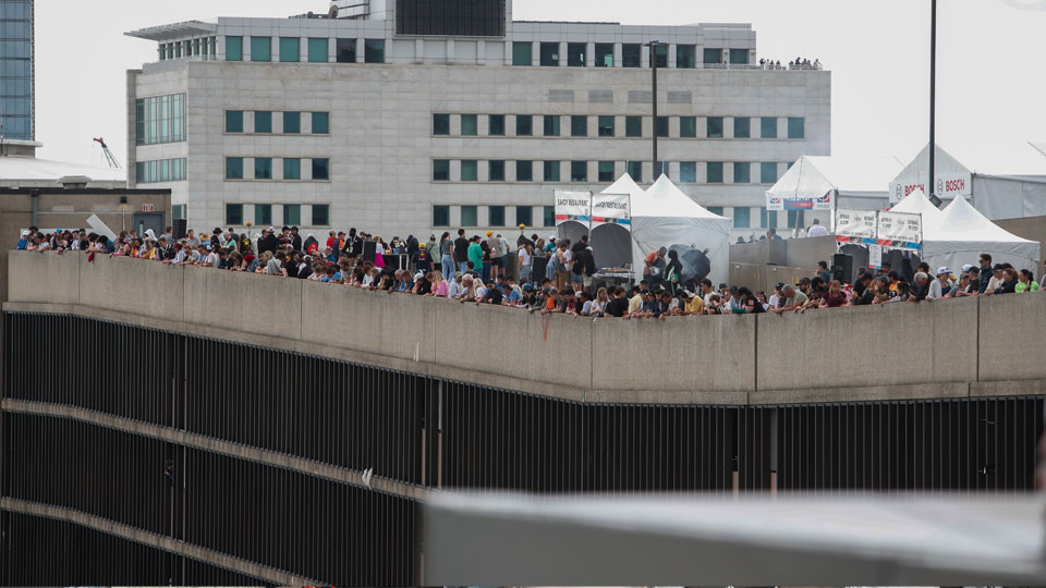 Fans watch the on track action from the Center Garage rooftop