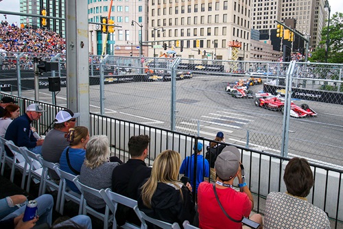 The view of cars on track from the Turn 3 Club
