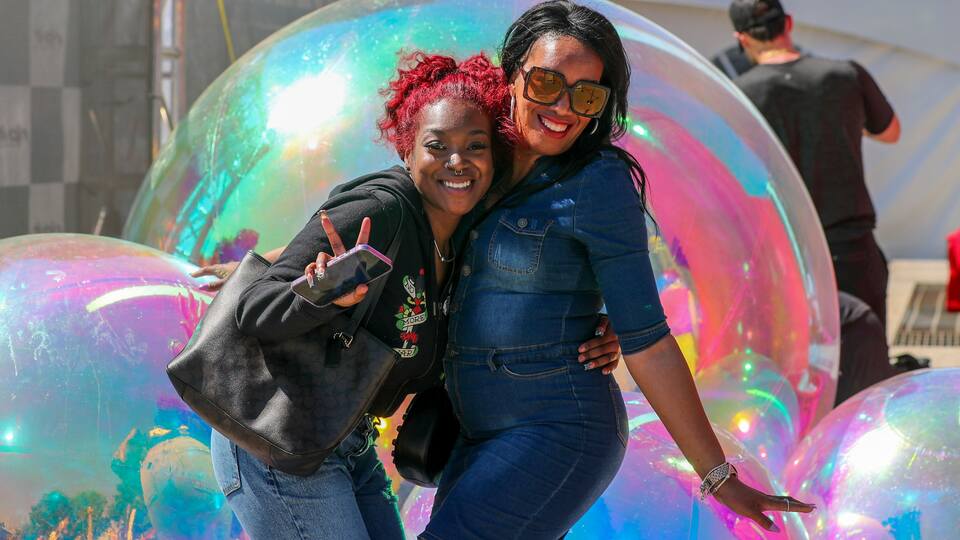 Fans pose with bubbles
